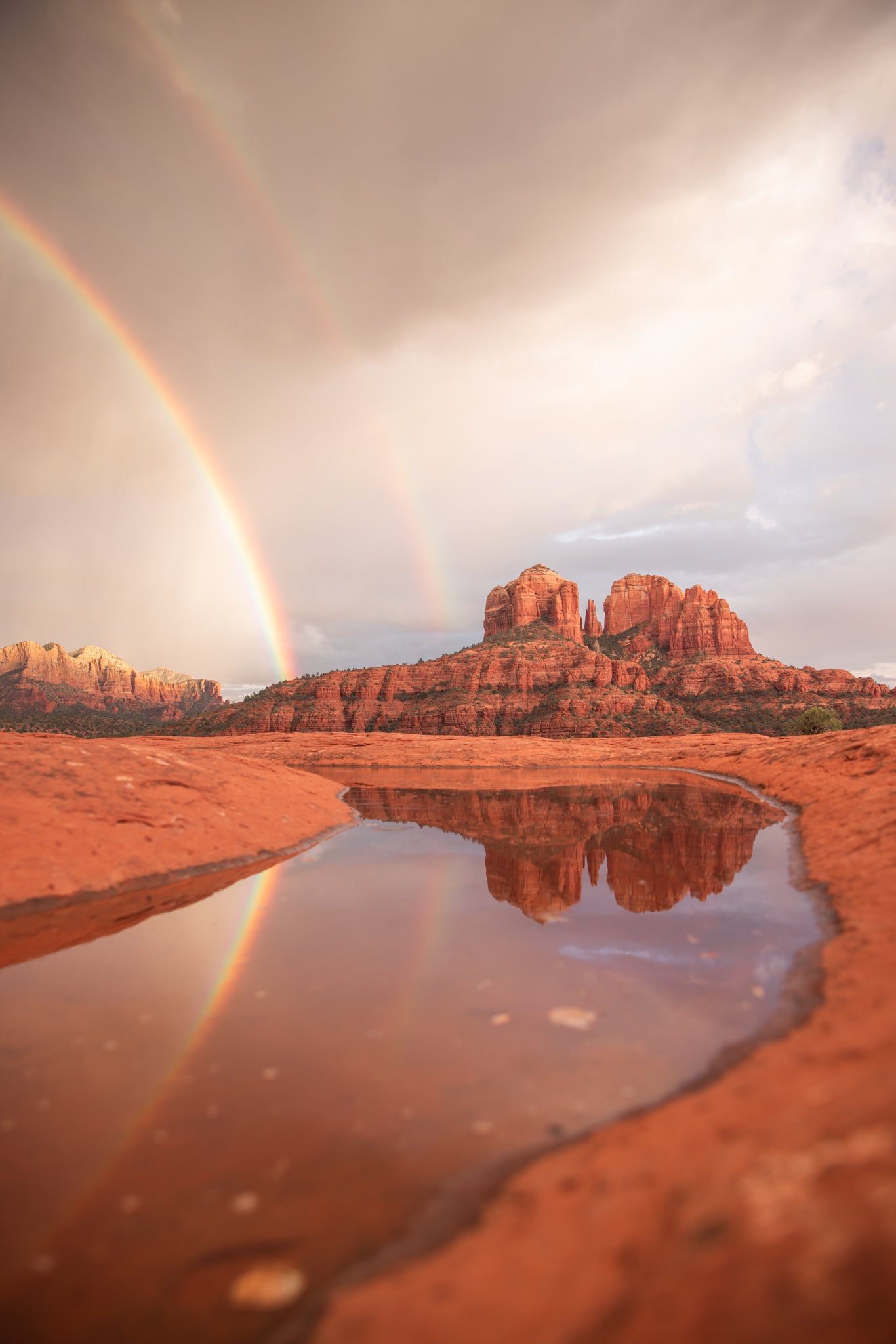 cathedral rock: rainbow reflecting in water in sedona, arizona