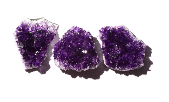 healing crystals: three amethyst geodes