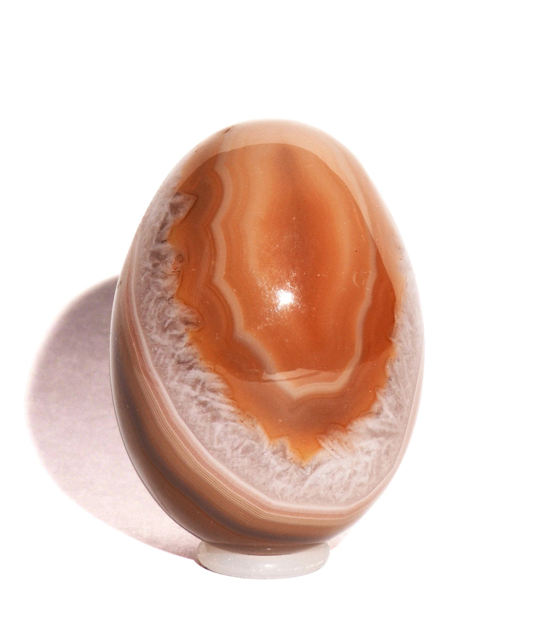 orange and white banged agate egg