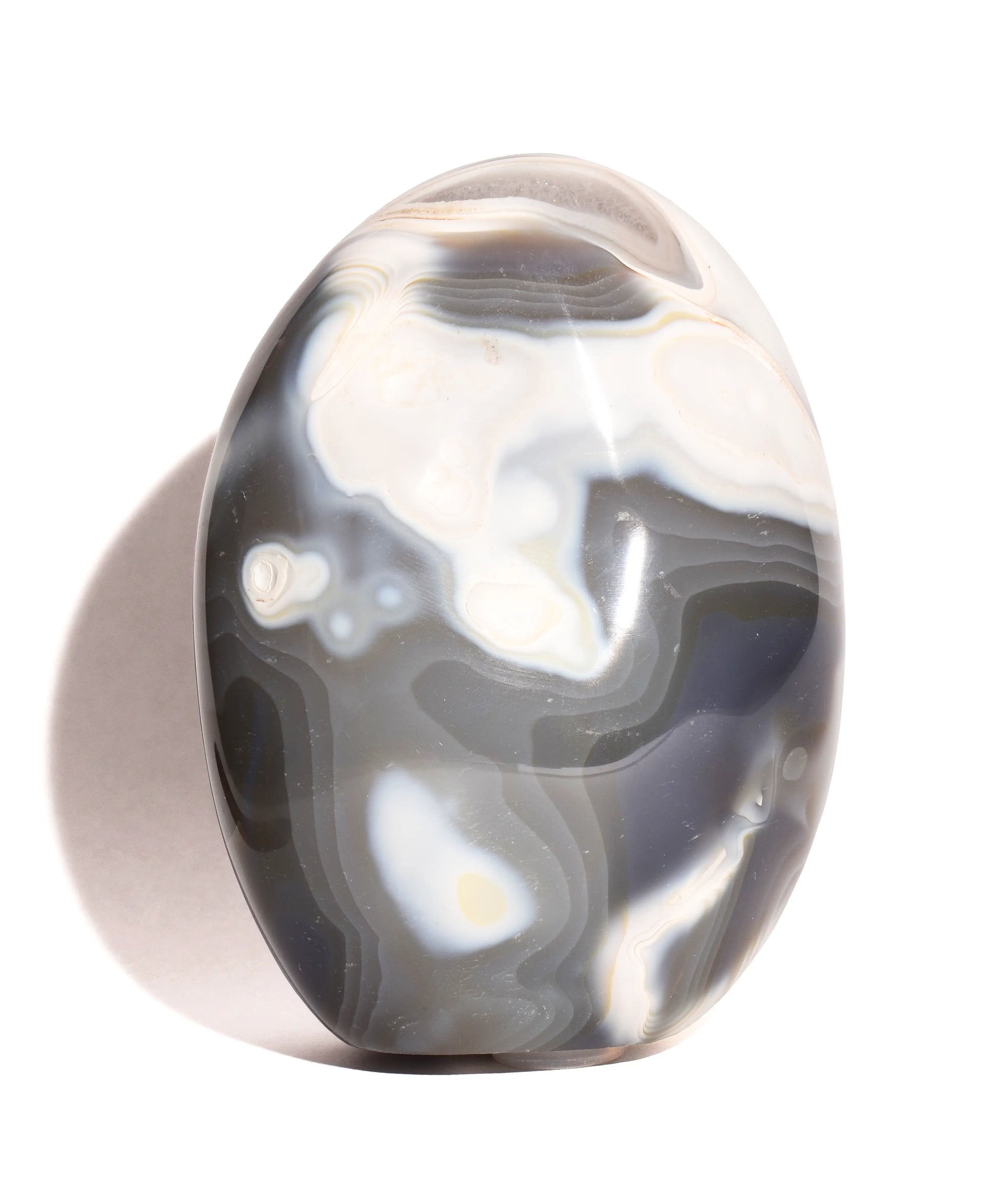 brown and white agate egg shaped flat bottom form