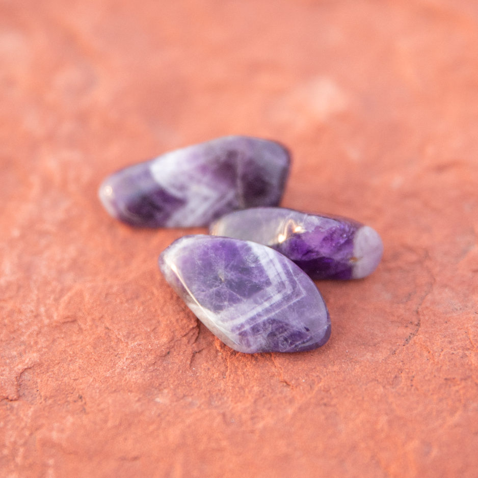 healing crystals: amethyst tumbled stone in sedona, arizona used for energy healing