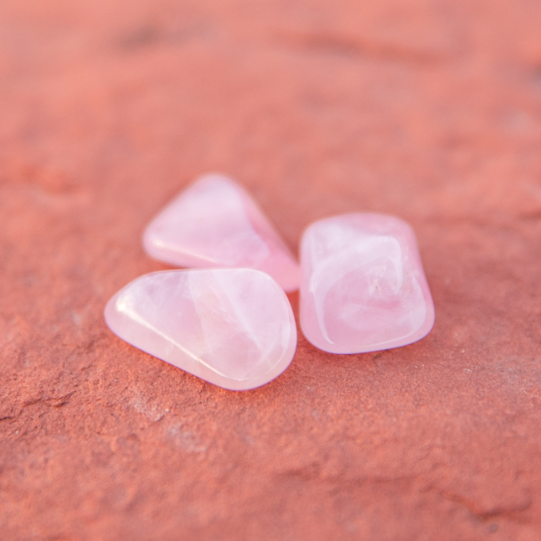 healing crystals: rose quartz tumbled stone in sedona, arizona used for energy healing