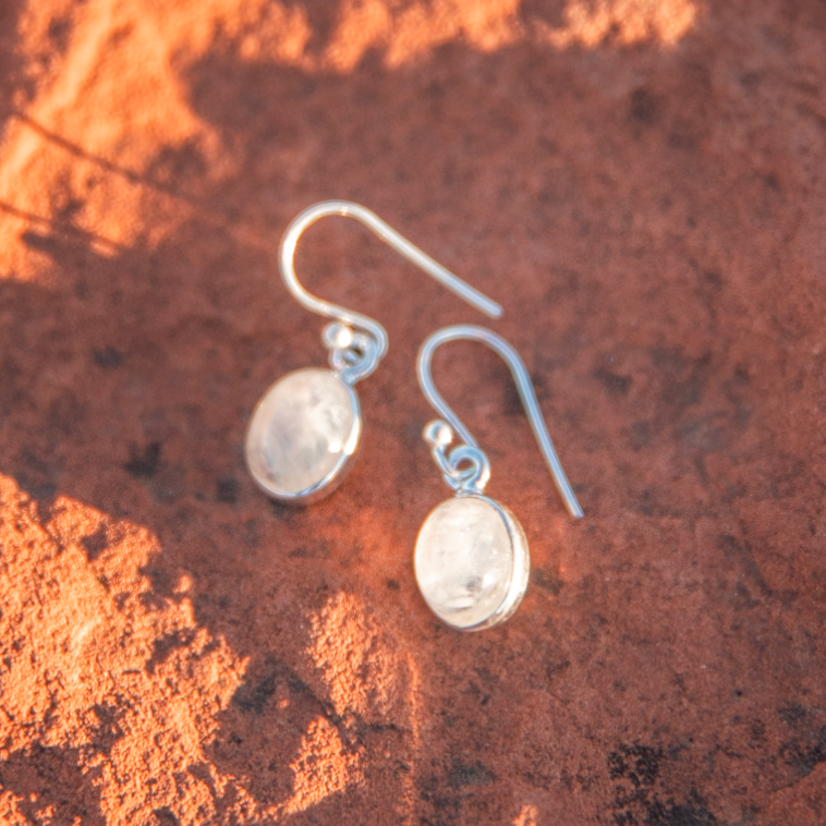 crystal jewelry: rainbow moonstone earrings in sedona, arizona used for energy healing