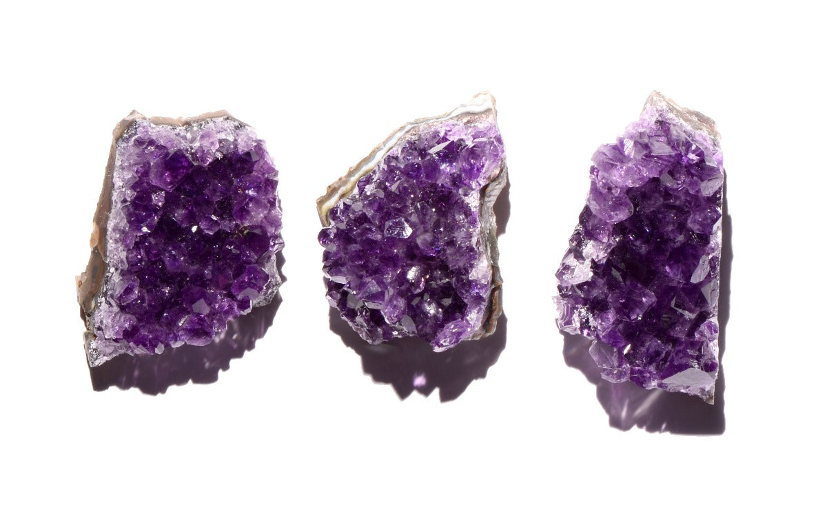 healing crystals: three amethyst geodes